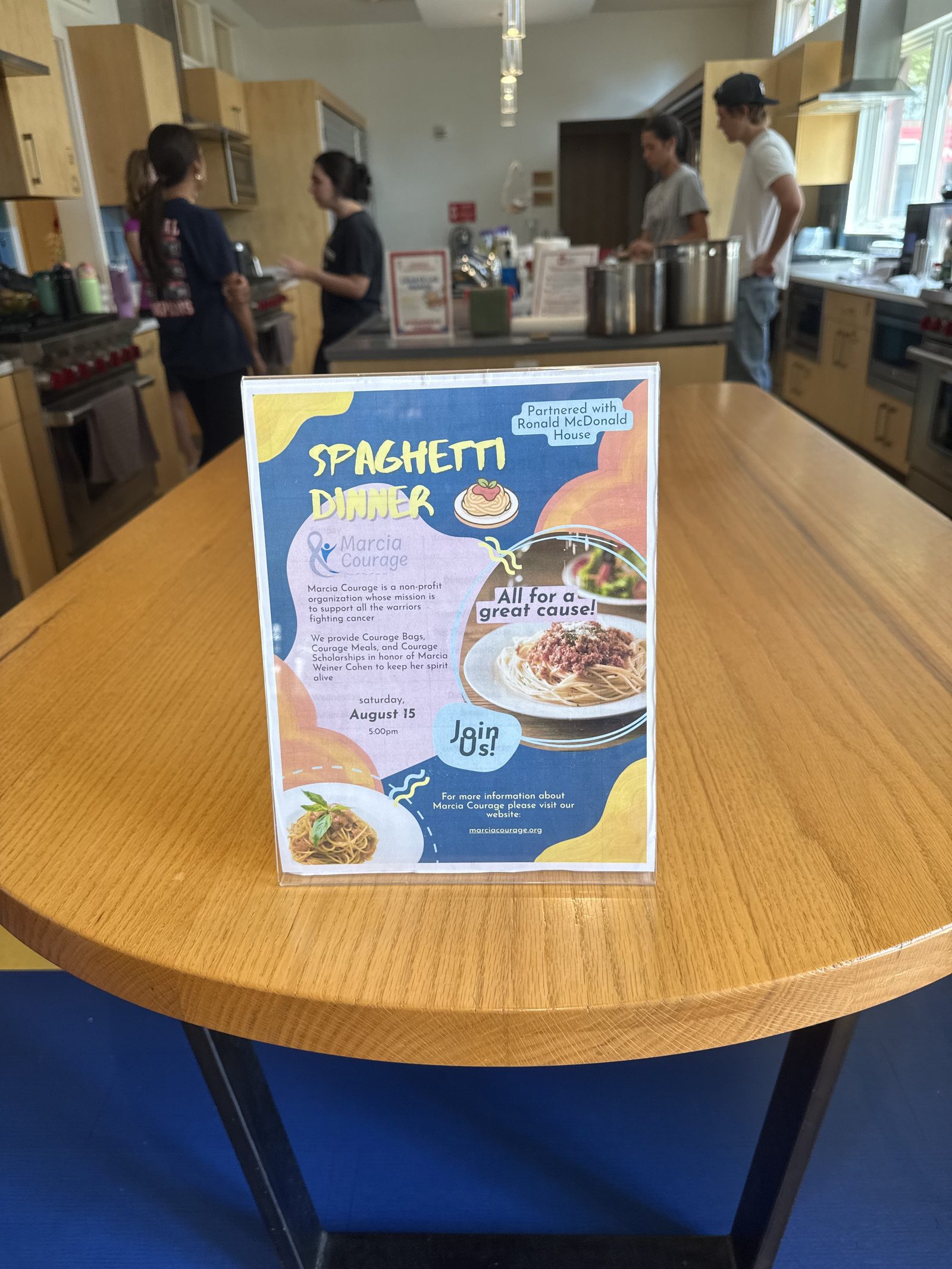 The Spaghetti Dinner flyer on display in the Ronald McDonald House kitchen